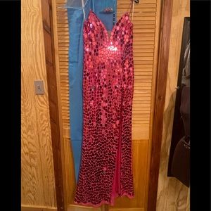 Stunning Sherri Hill dress in magenta! Glass beading